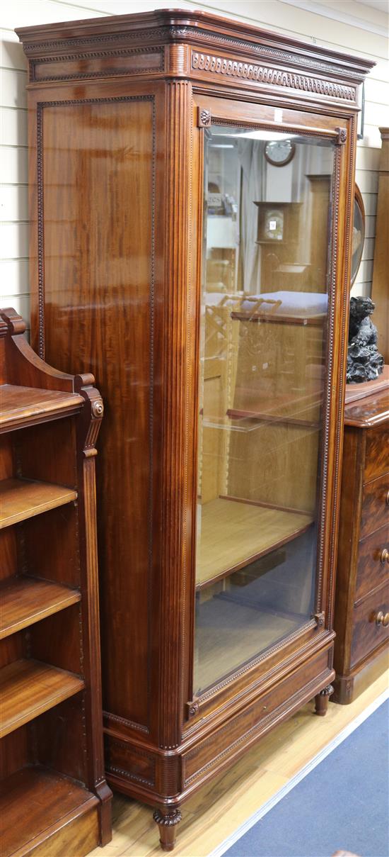 An early 19th century French mahogany bookcase, enclosed by a single glazed door, W.109cm